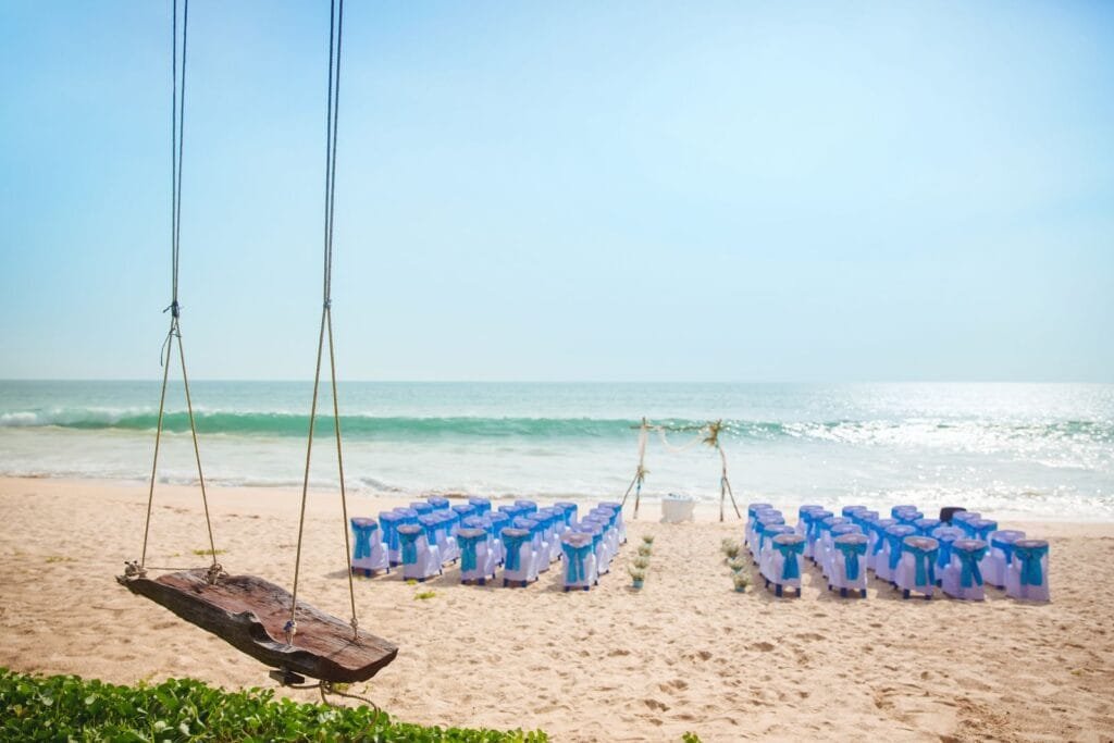 Beach altar view at Twin Villas Natai featuring a romantic seaside wedding setup in Phuket