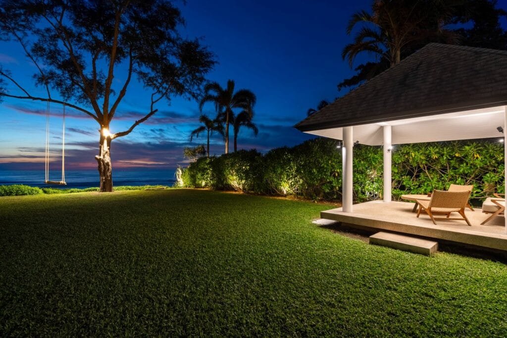 Romantic evening setup on the lawn of Twin Villas Natai, a Phuket wedding villa with oceanfront views