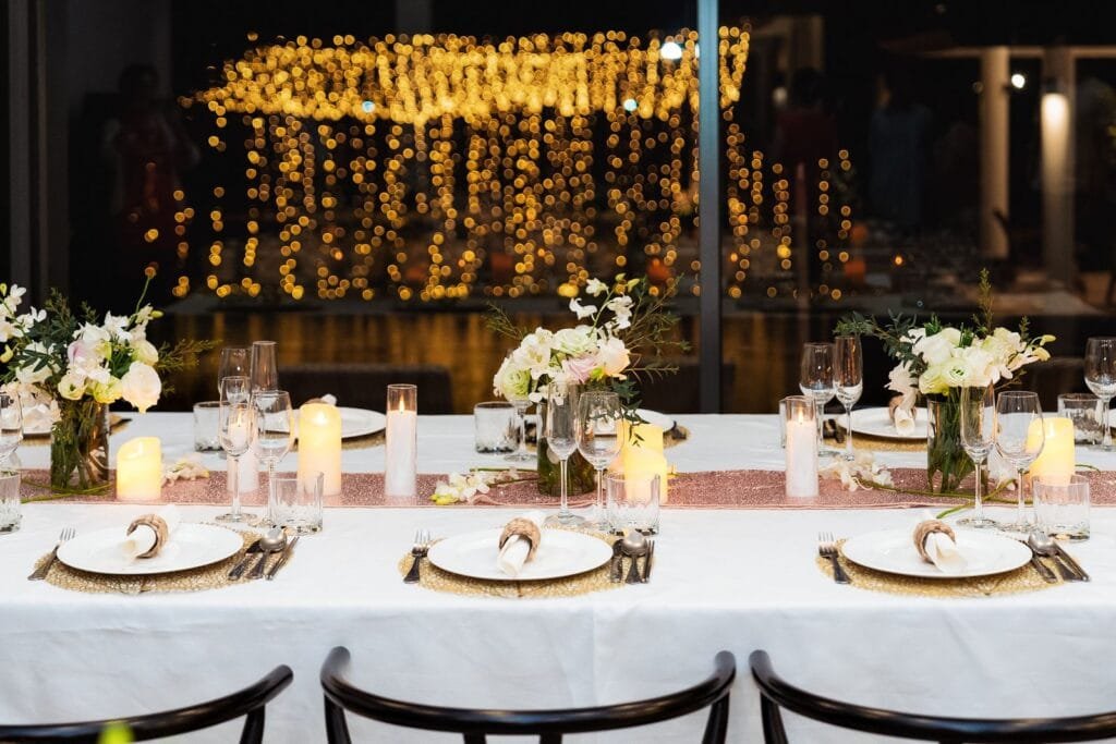 Elegant indoor pink-themed dining table set for a private wedding villa reception at Twin Villas Natai