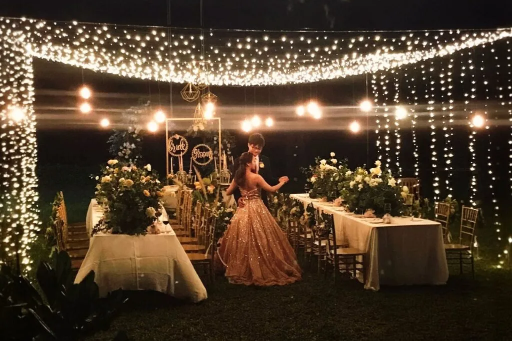 How to Plan a Private Beachfront Wedding at Twin Villas Natai — Complete Checklist | Twin Villas Natai Outdoor wedding reception on the lawn at Twin Villas Natai illuminated with romantic string lights