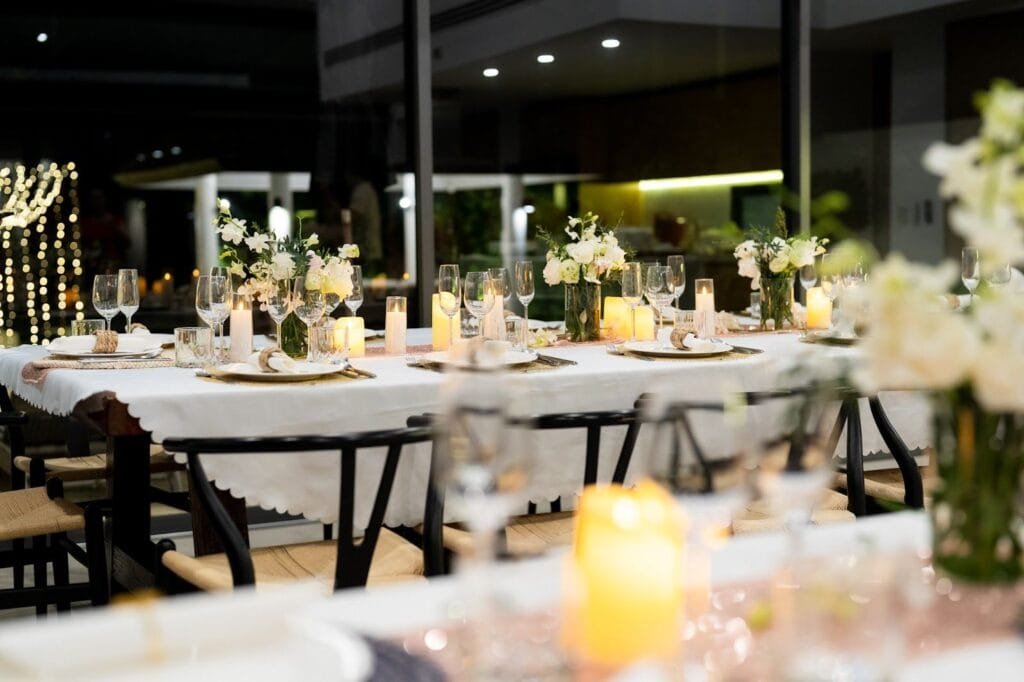 Retreat dinner celebration on the beachfront deck at Twin Villas Natai — exclusive villas Phuket for events and retreats