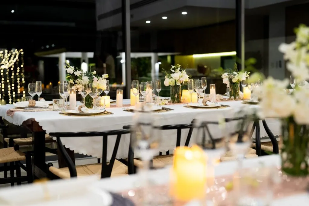 Two Villas, One Estate: A combined 10-Bedroom Private Estate near Phuket for Large Groups | Twin Villas Natai Retreat dinner celebration on the beachfront deck at Twin Villas Natai — exclusive villas Phuket for events and retreats