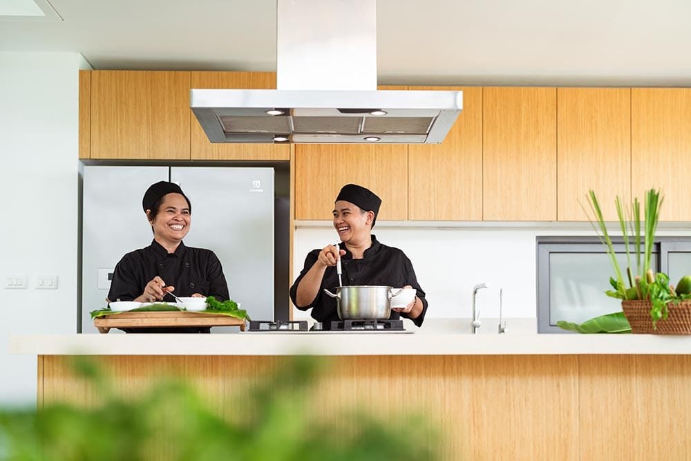 Retreat Villas Near Phuket – A Private Beachfront Wellness Sanctuary at Twin Villas Natai | Twin Villas Natai In-villa chefs preparing fresh meals in a modern professional kitchen for a retreat program