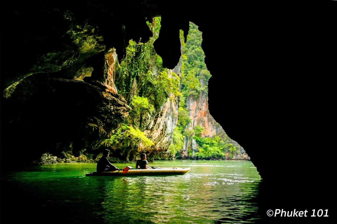 Discover Phang Nga Attractions: The Best Day Trips from Natai Beach, Thailand | Twin Villas Natai Sea canoe entering a limestone cave at Koh Hong in Phang Nga Bay.