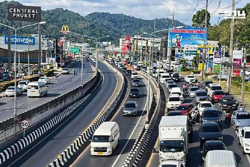 Discover Phang Nga Attractions: The Best Day Trips from Natai Beach, Thailand | Twin Villas Natai Multi-lane road in Phuket with heavy traffic during peak hours near commercial areas.