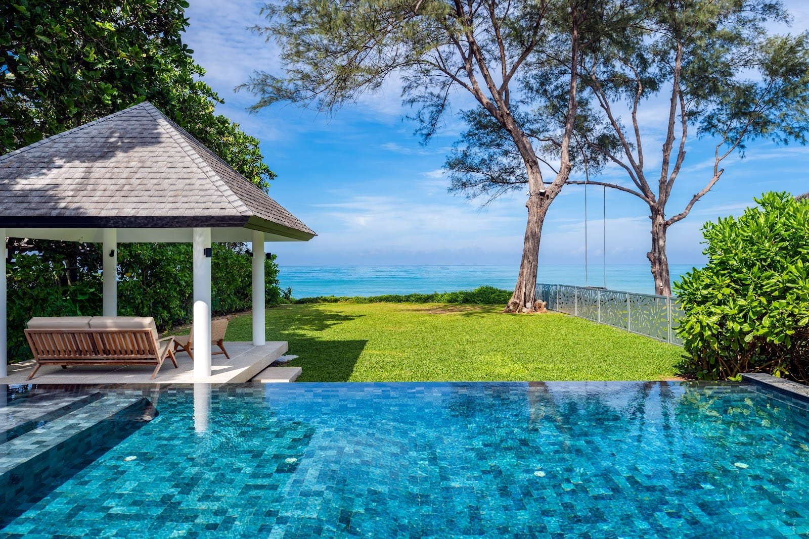 Natai Beach or Phuket? The Discerning Traveler’s Guide to Privacy and Access | Twin Villas Natai Infinity pool and beachfront garden at Twin Villas Natai on Natai Beach, Phang Nga, Thailand.