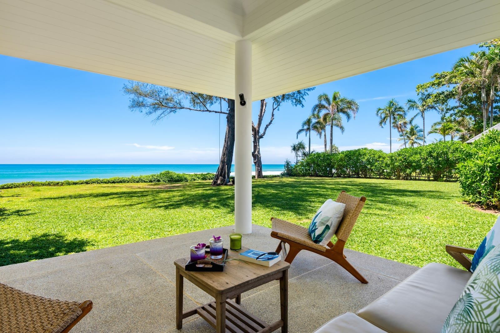 Natai Beach or Phuket? The Discerning Traveler’s Guide to Privacy and Access | Twin Villas Natai Wide view of Twin Villas Natai beachfront estate with lawn and ocean outlook in Phang Nga province.